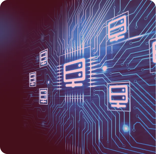 A group of people sitting around a table working on a laptop.